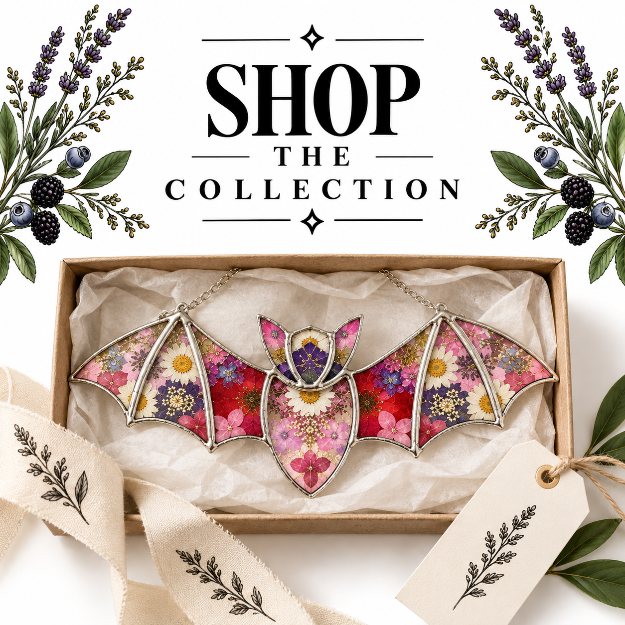Colorful stained glass butterfly jewelry with floral design in a gift box, surrounded by flowers and greenery, with the text "Shop the Collection" above.