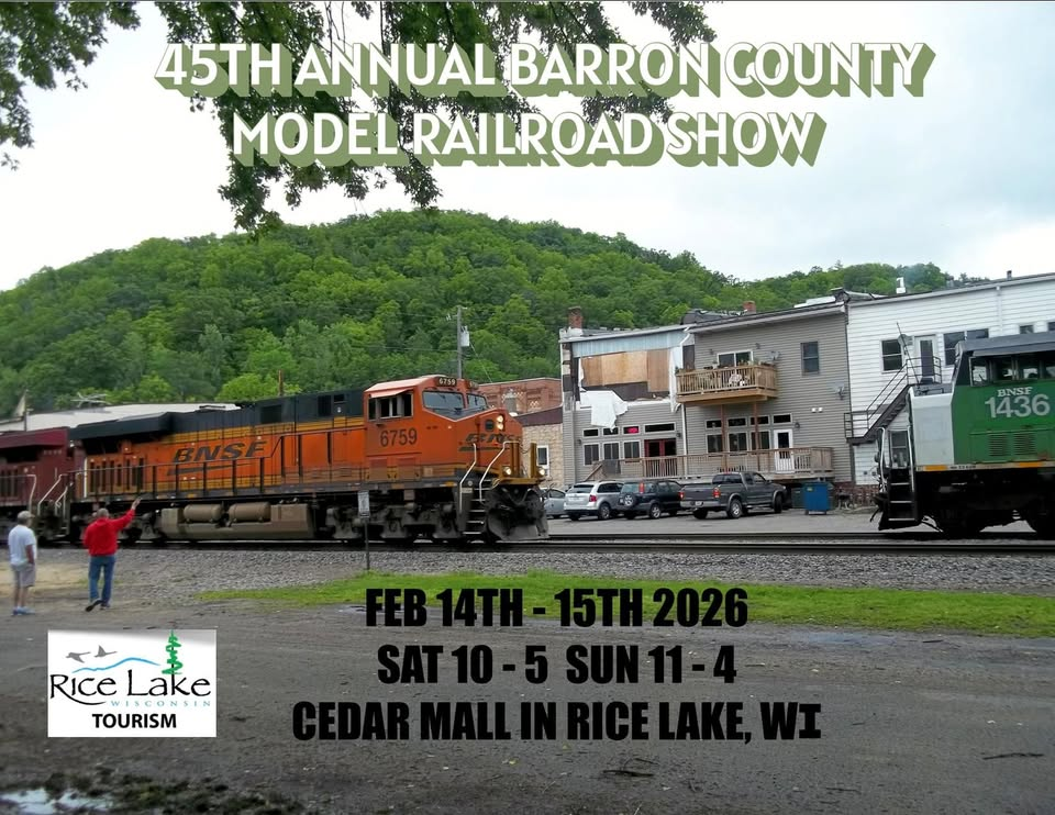 Promotional poster for the 45th Annual Barron County Model Railroad Show at Cedar Mall in Rice Lake, Wisconsin, from February 14th to 15th, 2026, with hours on Saturday from 10 am to 5 pm and Sunday from 11 am to 4 pm. The background shows model trains on tracks with buildings and a green hill, and the logo for Rice Lake Tourism is in the bottom left corner.