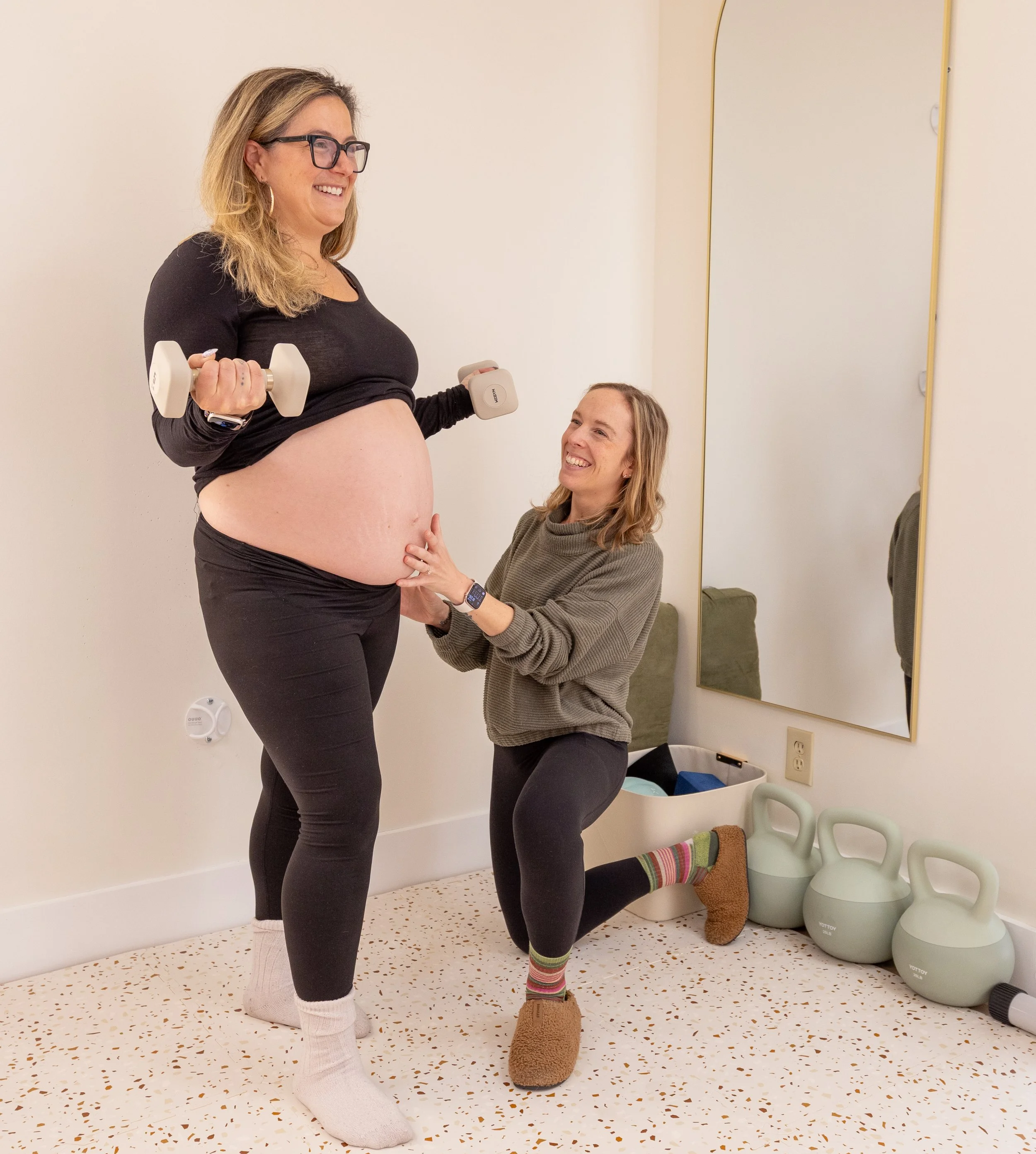 Dr. Emma Long works with a pregnant patient on pregnancy safe exercise
