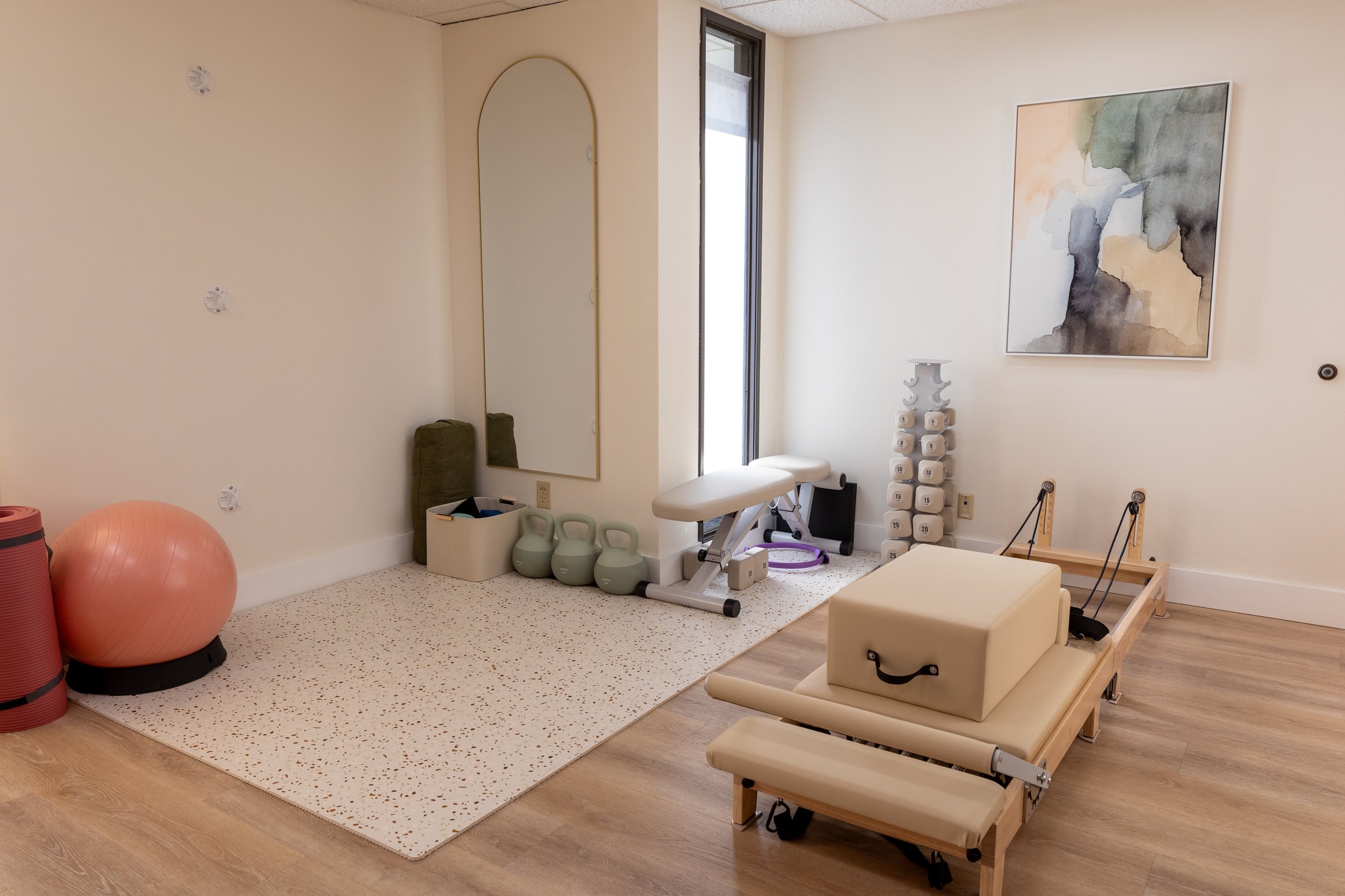 Terra Pelvic Health Gym / Exercise area including a pilates reformer and weights
