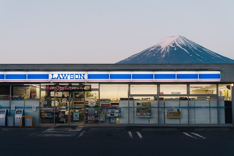 A Lawson convenience store with Mount Fuji in the background.