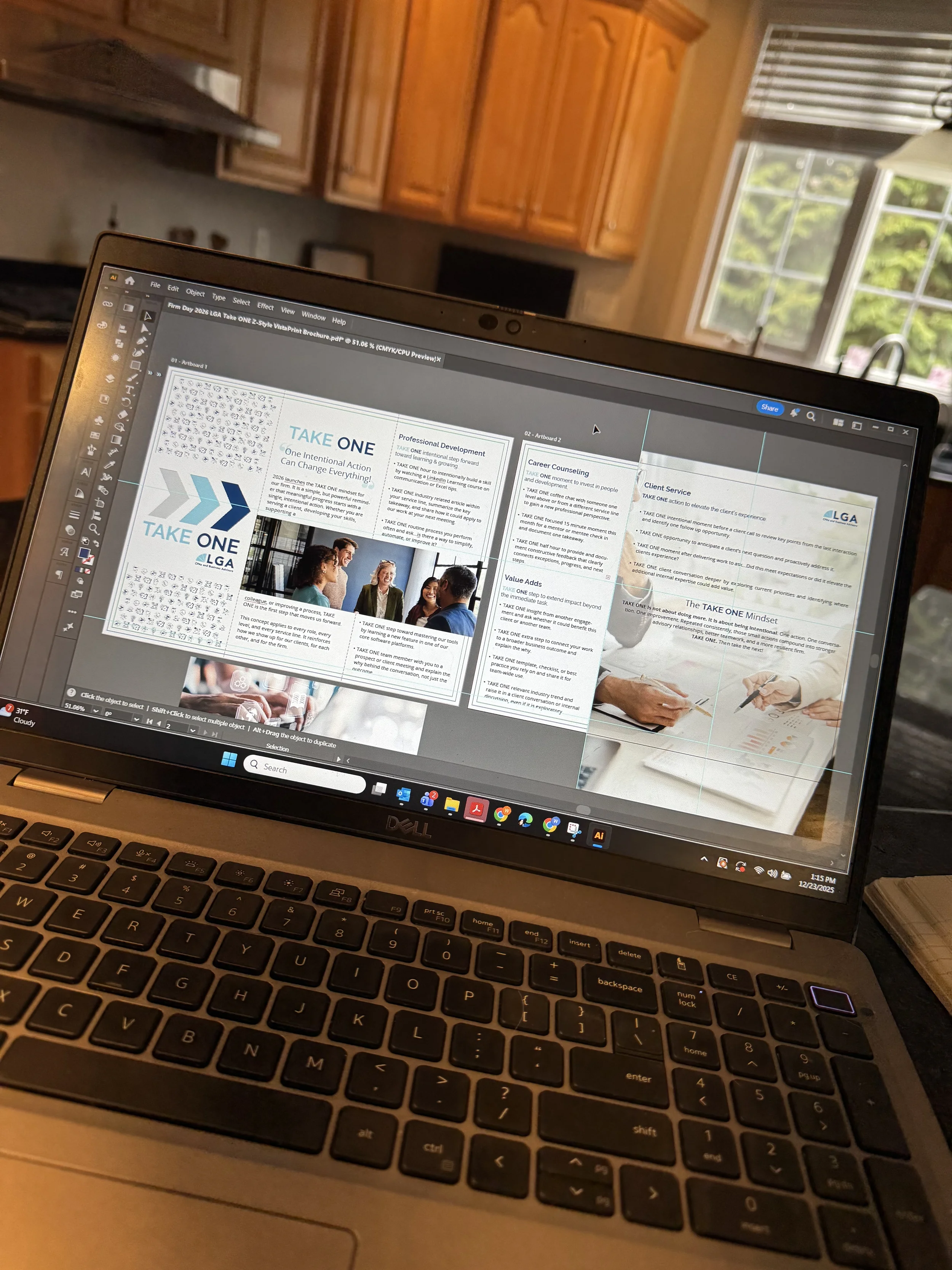 A laptop displaying a PDF file titled 'Firm Day 2026 LGA Take ONE Z-Style VistaPrint Brochure.pdf' with various sections about professional development, career counseling, client service, and values. The background shows a kitchen with wooden cabinet