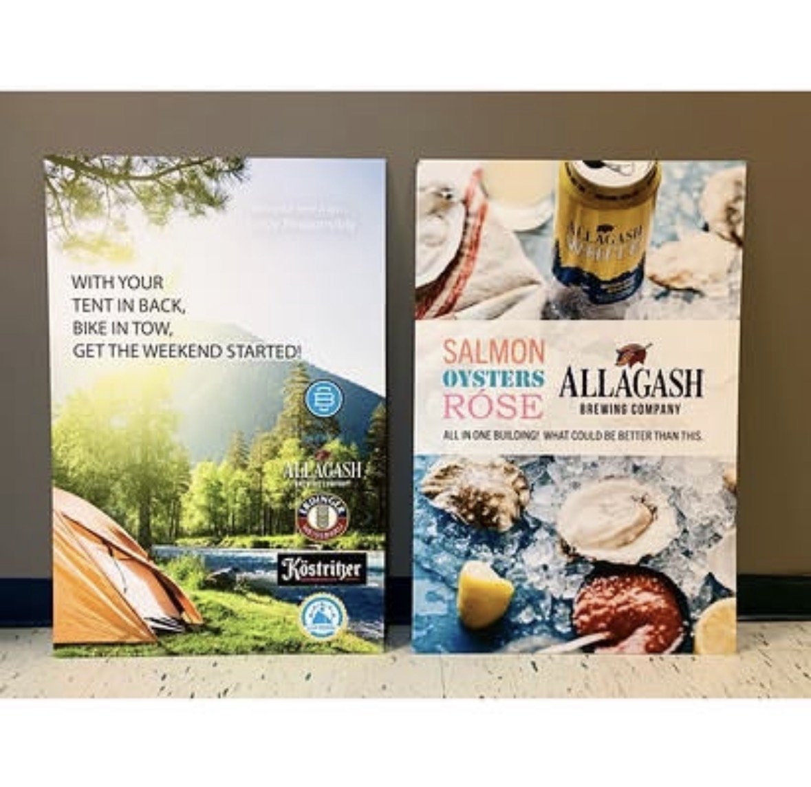 Two vertical banners advertising Allagash Brewing Company, featuring outdoor and seafood themes. The left banner shows camping with a tent and forest scene, with text about camping and biking. The right banner highlights seafood including salmon, oys
