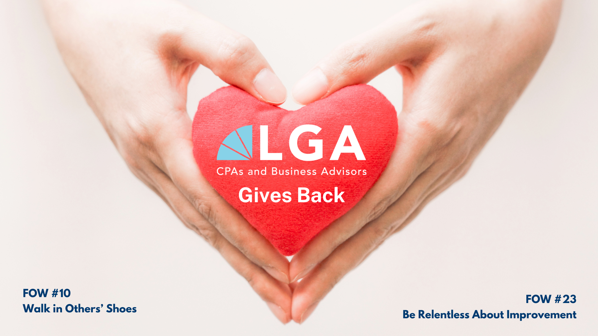 Person holding a red plush heart with text overlay that reads "LGA CPAs and Business Advisors Gives Back."