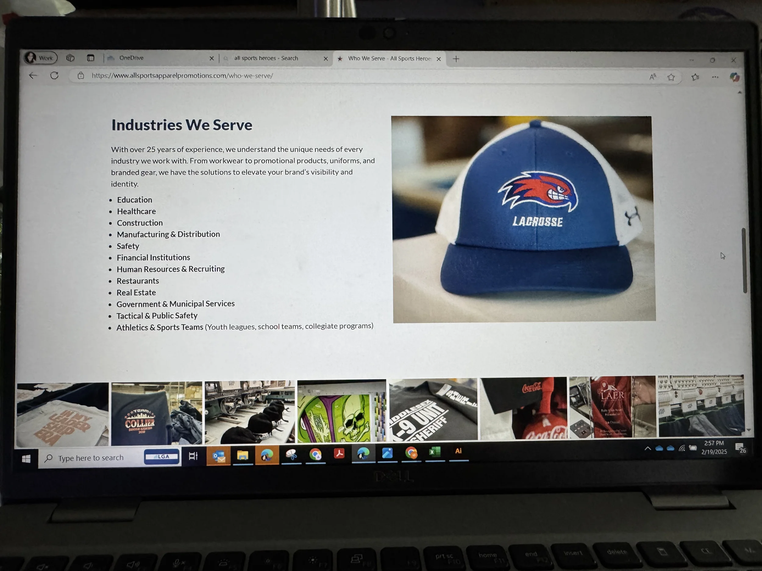 A computer screen displaying a webpage with the title 'Industries We Serve' and a list of industries, alongside a photograph of a blue baseball cap with a red and white logo and the word 'LACROSSE' embroidered on it.