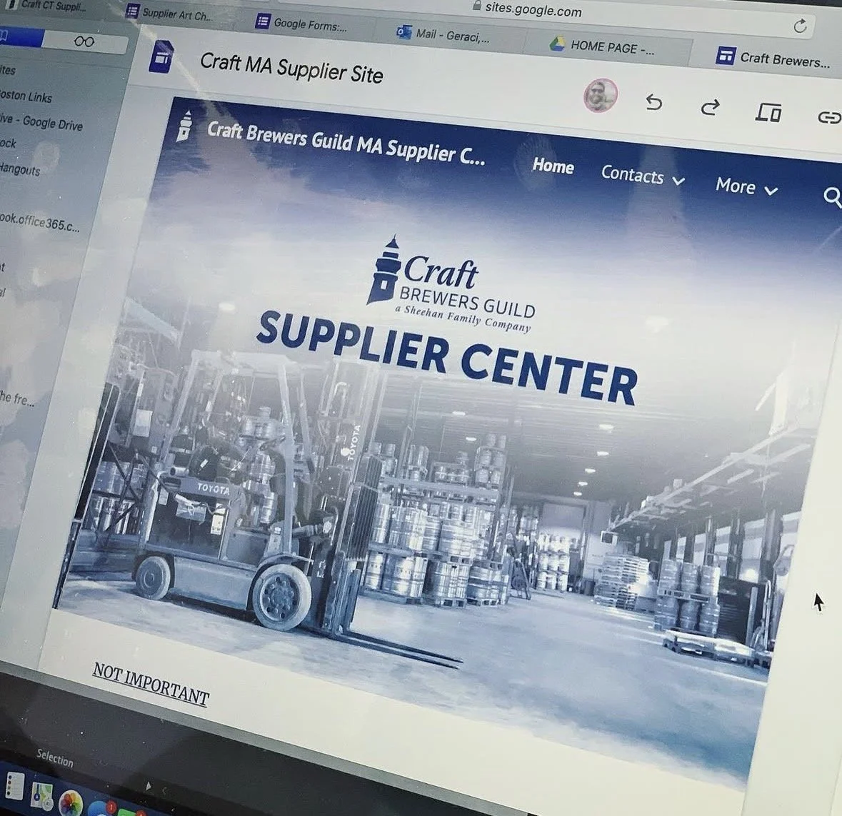 Screenshot of a website titled 'Craft Brewers Guild MA Supplier Center' showcasing a storage area with stacked barrels and a forklift.