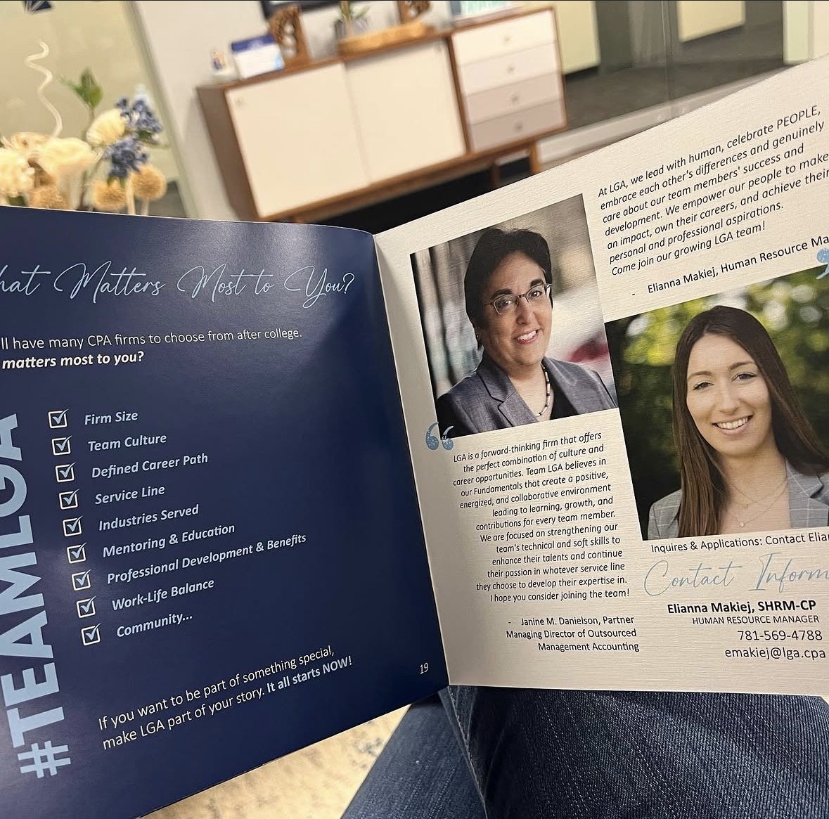 Open brochure featuring a woman with glasses and a blazer smiling, alongside another woman with long hair, outdoors in a professional setting. The brochure discusses team culture, career opportunities, and professional development.