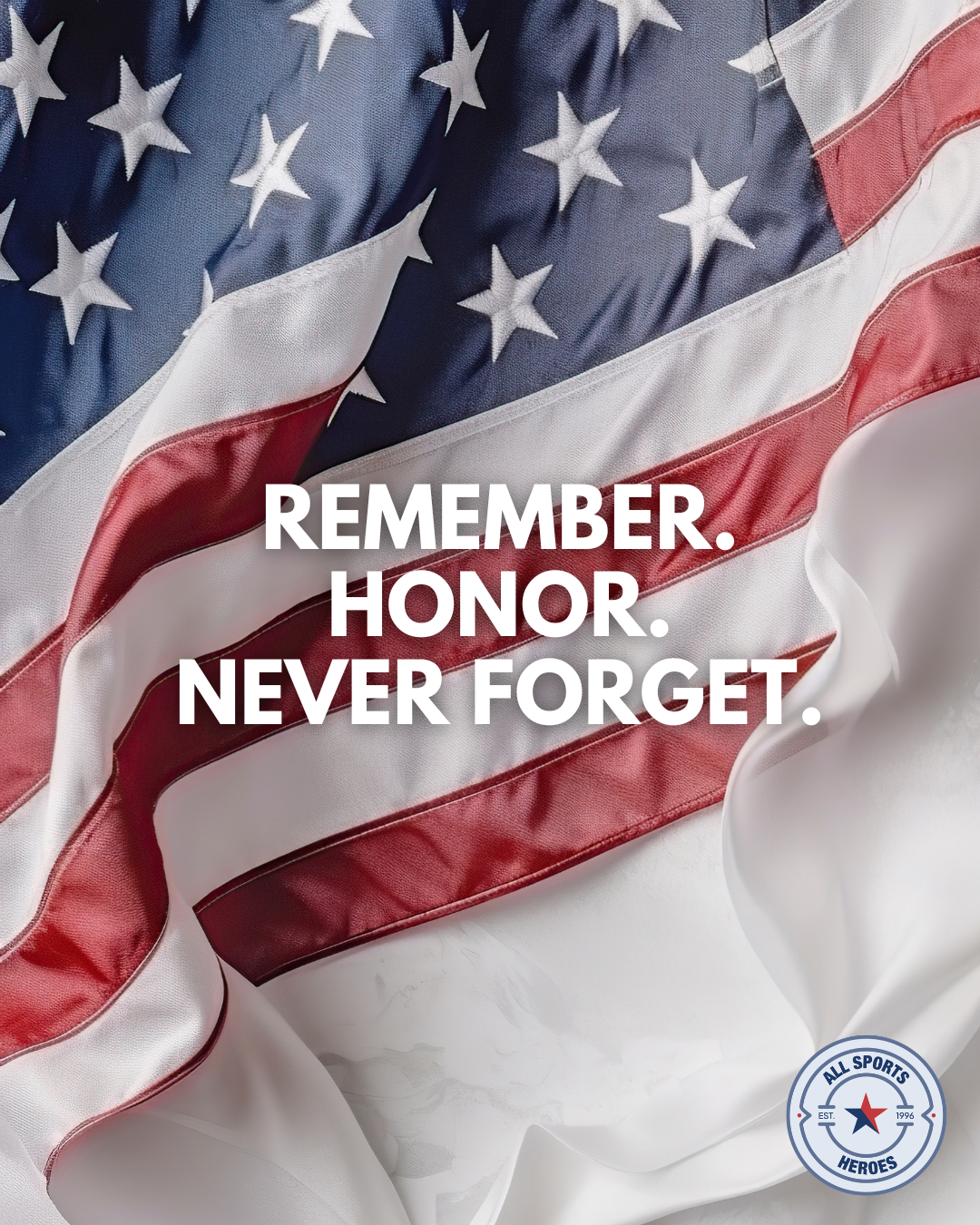 Close-up of an American flag with the words "Remember. Honor. Never Forget." overlaid and a small circular logo reading "All Sports Heroes."