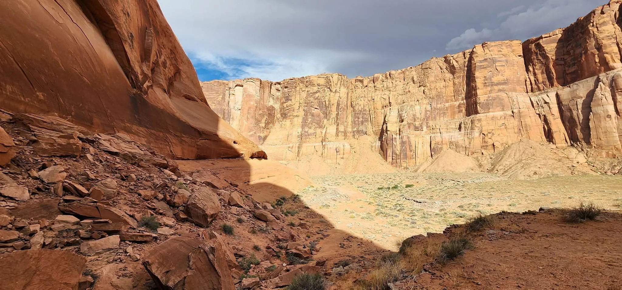 Looking out from on the side of Horseshoe Bend at the cliff above