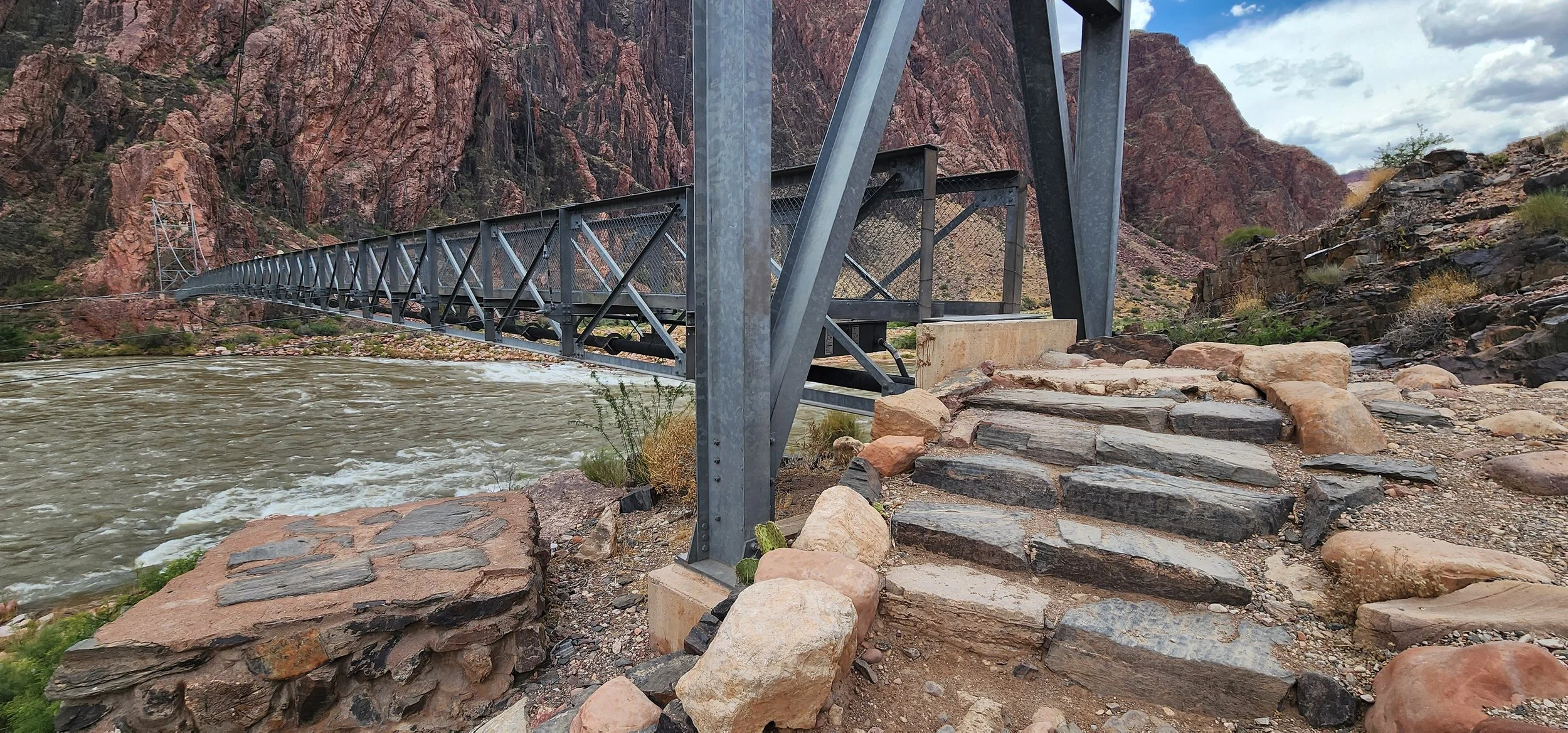 The silver bridge at the bottom of the Grand Canyon crossing the Colorado River