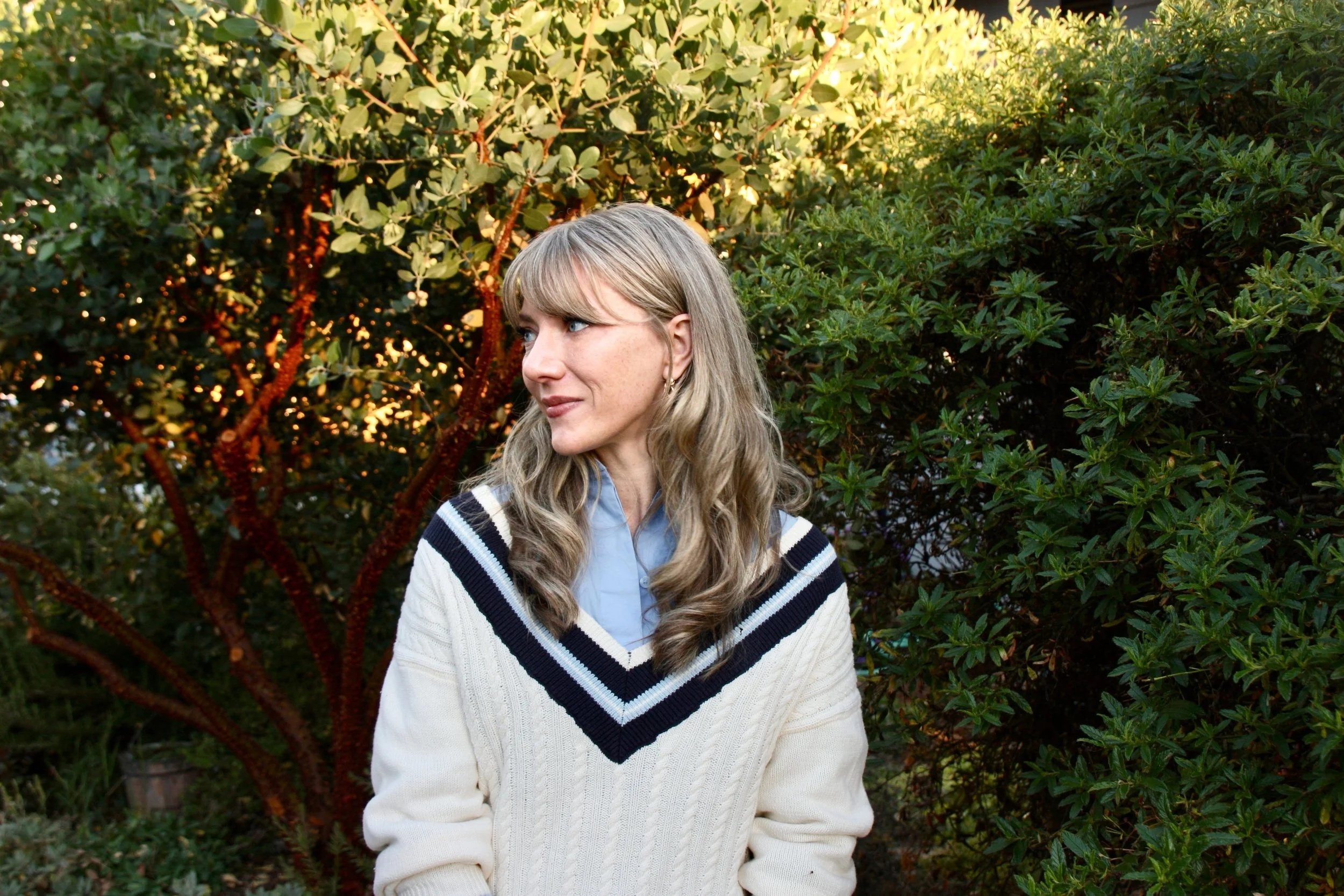 Licensed therapist standing in front of tree, In person Washington, Trauma Therapist, EMDR