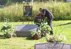 Royce’s son, Richard, lays a wreath at his Dad’s grave site