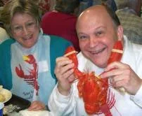 Our distinguished President, Herb Hartman, enjoys his Maine lobster