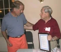 Timothy Griswold, First Selectman, awards Virgil a proclamation from the town of Old Lyme. “I love the award...but did you know we're related?”