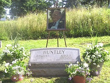 Photograph of Royce Huntley, the founder of HNA, at his grave site in Phoenix, New York.