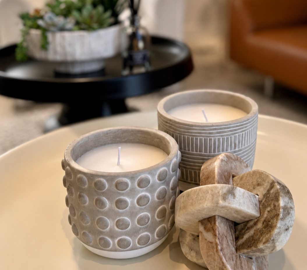 Styled studio decor at Green Orange Studio with candles, soft textures, and warm details for photography, wellness content, and creative sessions.