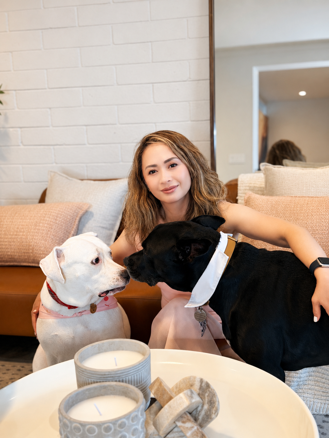 Pet-friendly creative studio in North Phoenix with cozy sofa seating, dogs, candles, and a relaxed lifestyle setting for photoshoots.