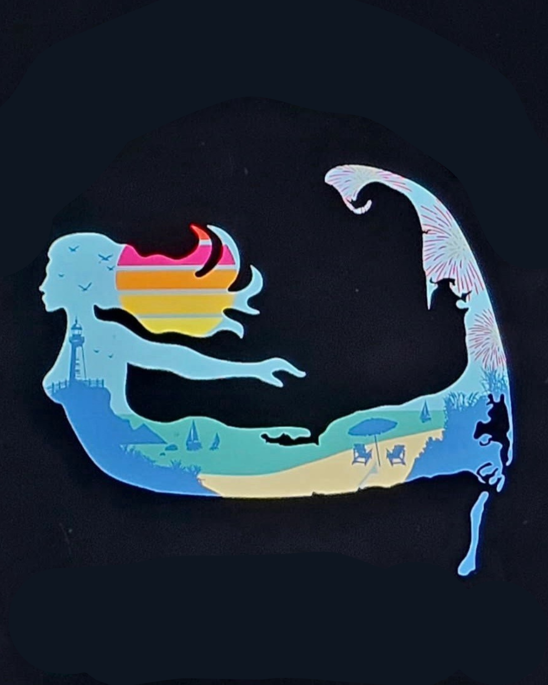 A silhouette of a mermaid with a beach scene inside, including a lighthouse, sailboats, lounge chairs, an umbrella, and fireworks, on a black background.