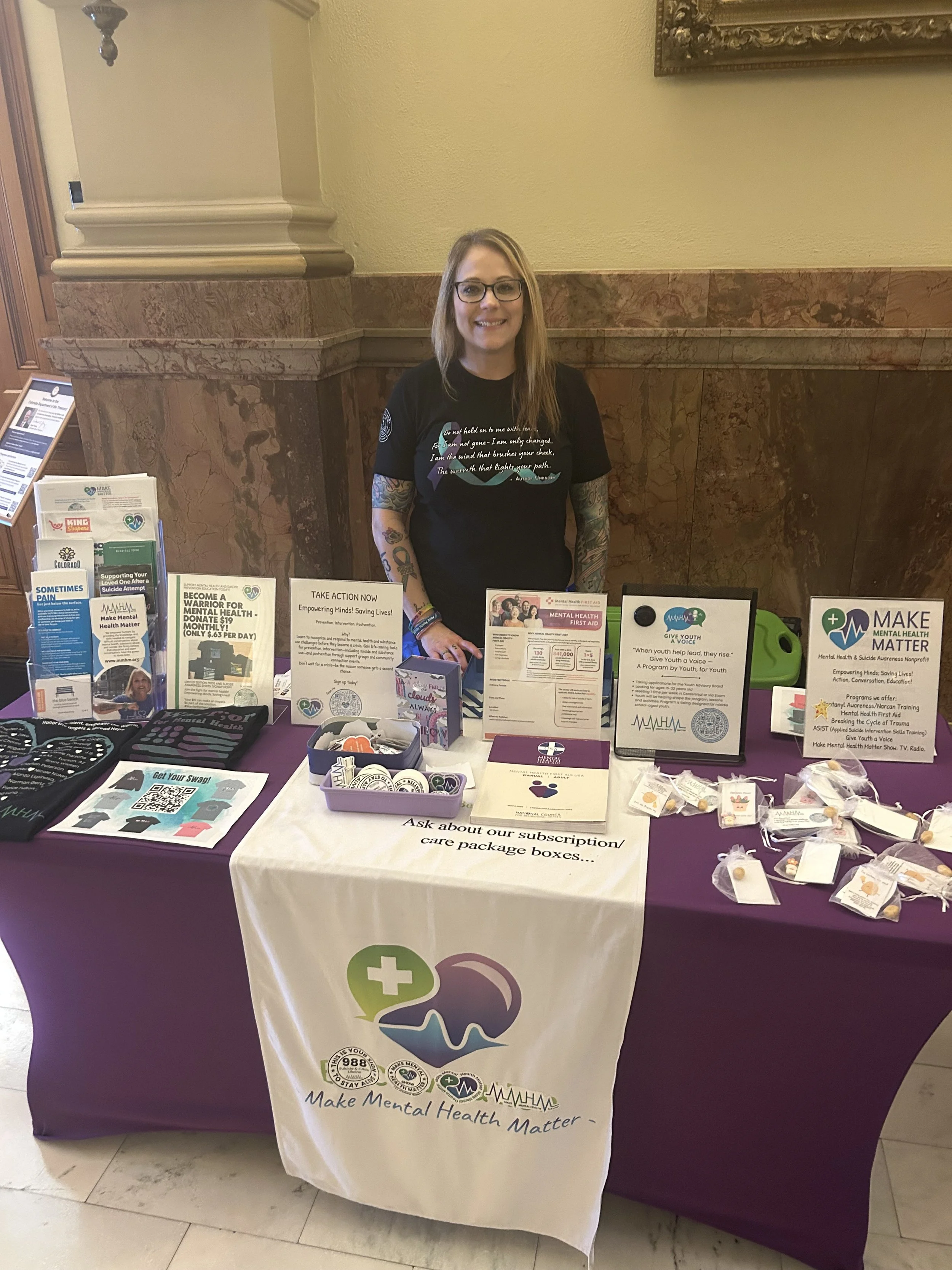 Make Mental Health Matter representative at a community resource table.