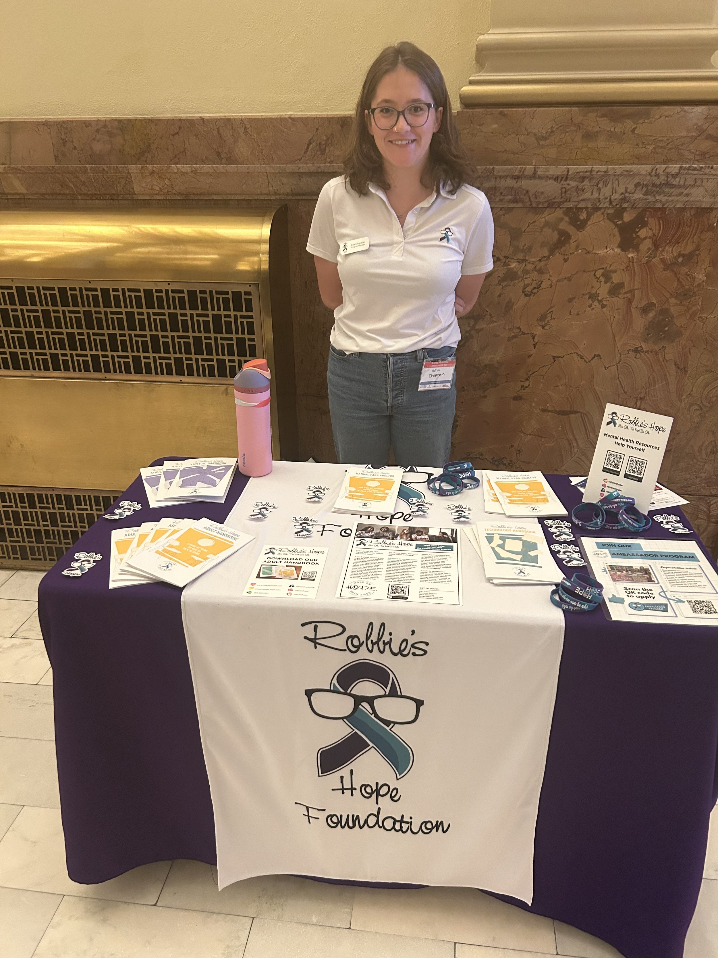 Robbie’s Hope representative at a youth mental-health resource table.
