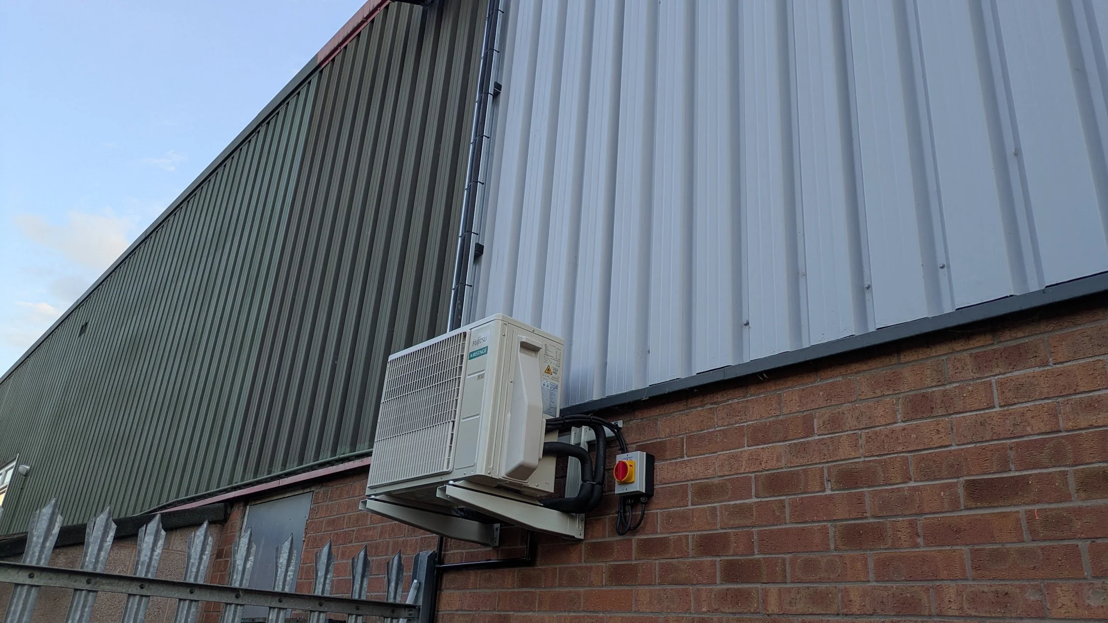 Air conditioning outdoor unit installation by Johnson Stratton Services