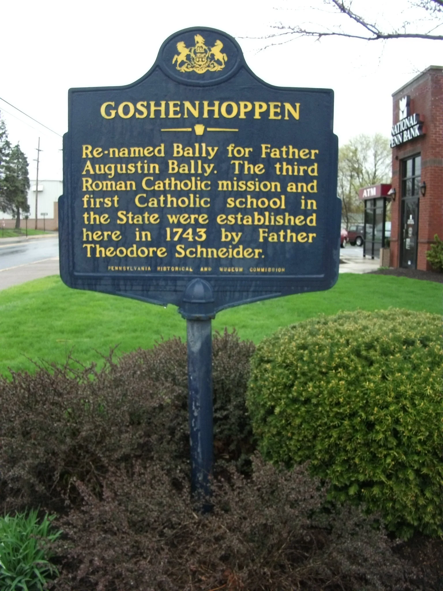 Historical marker in Goshenhoppen, Pennsylvania, explaining it was renamed by Father Augustin Bally, who established the first Catholic school in the state there in 1743, by Father Theodore Schneider.