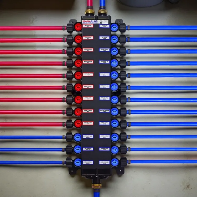 A manifold with multiple red and blue pipes connected to it, used for controlling air or fluid flow in a plumbing or HVAC system.