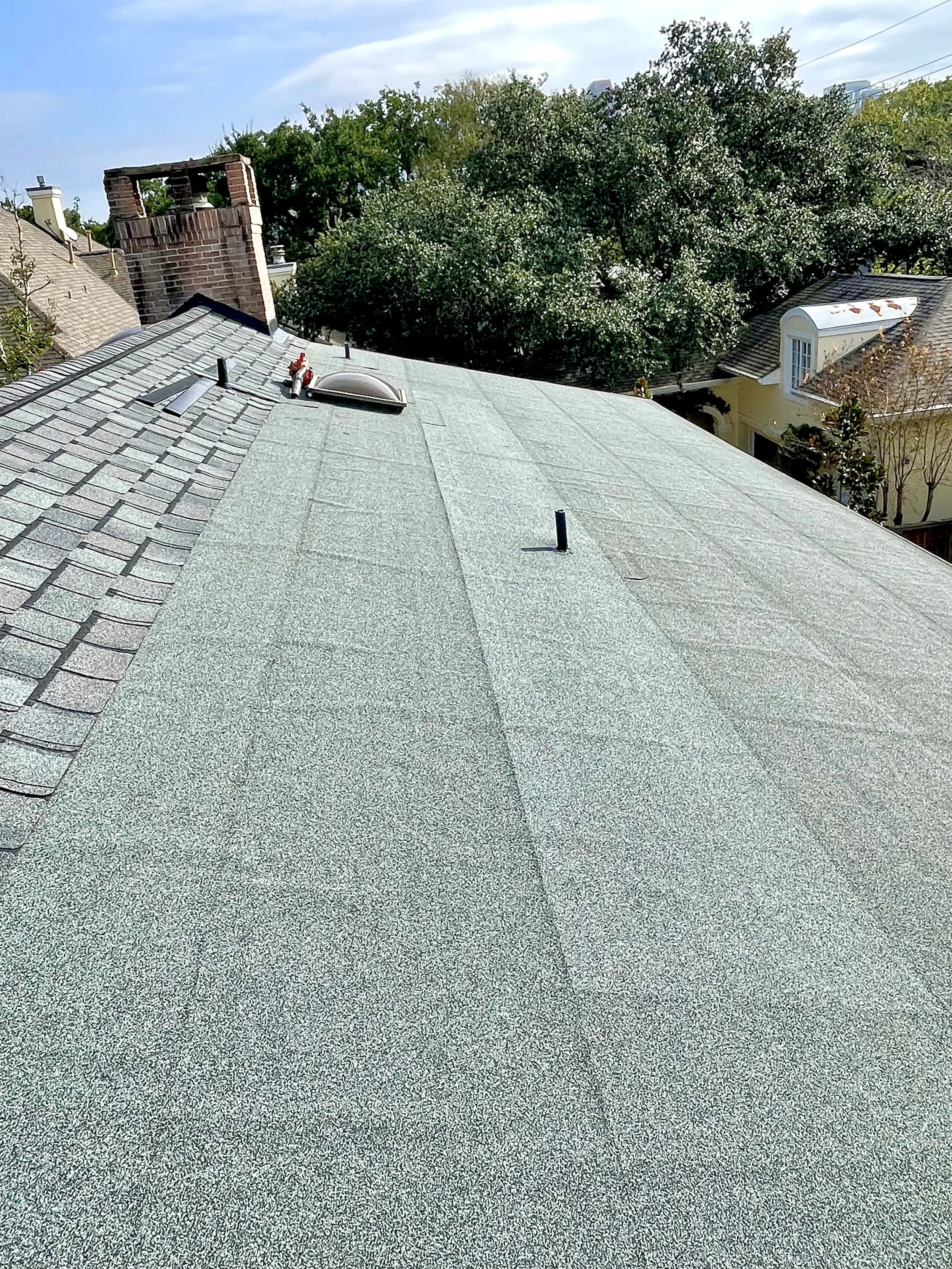 Self Adhered low slope roofing system on a roof replacement project in downtown Houston, Texas