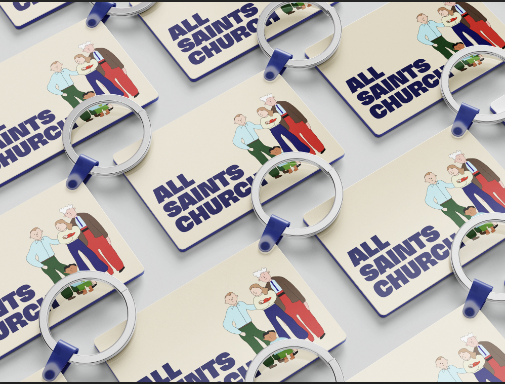 Postcards with a church logo and illustration of diverse people, multiple keychains placed on top.