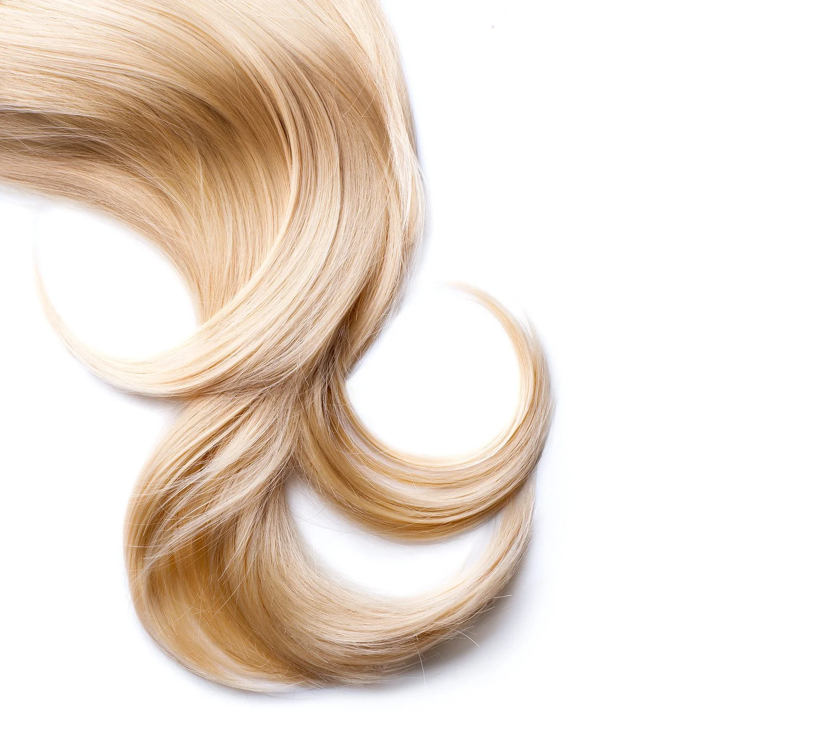 Close-up of blonde hair extensions on a white background.