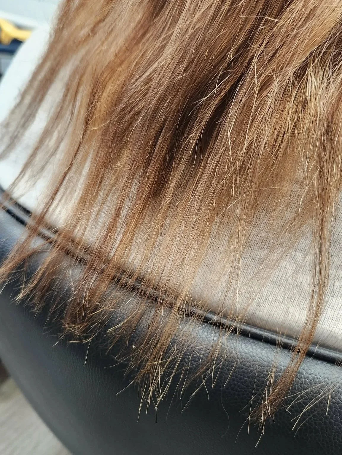 uniform layer hair cut woman sitting in hairdresser chair