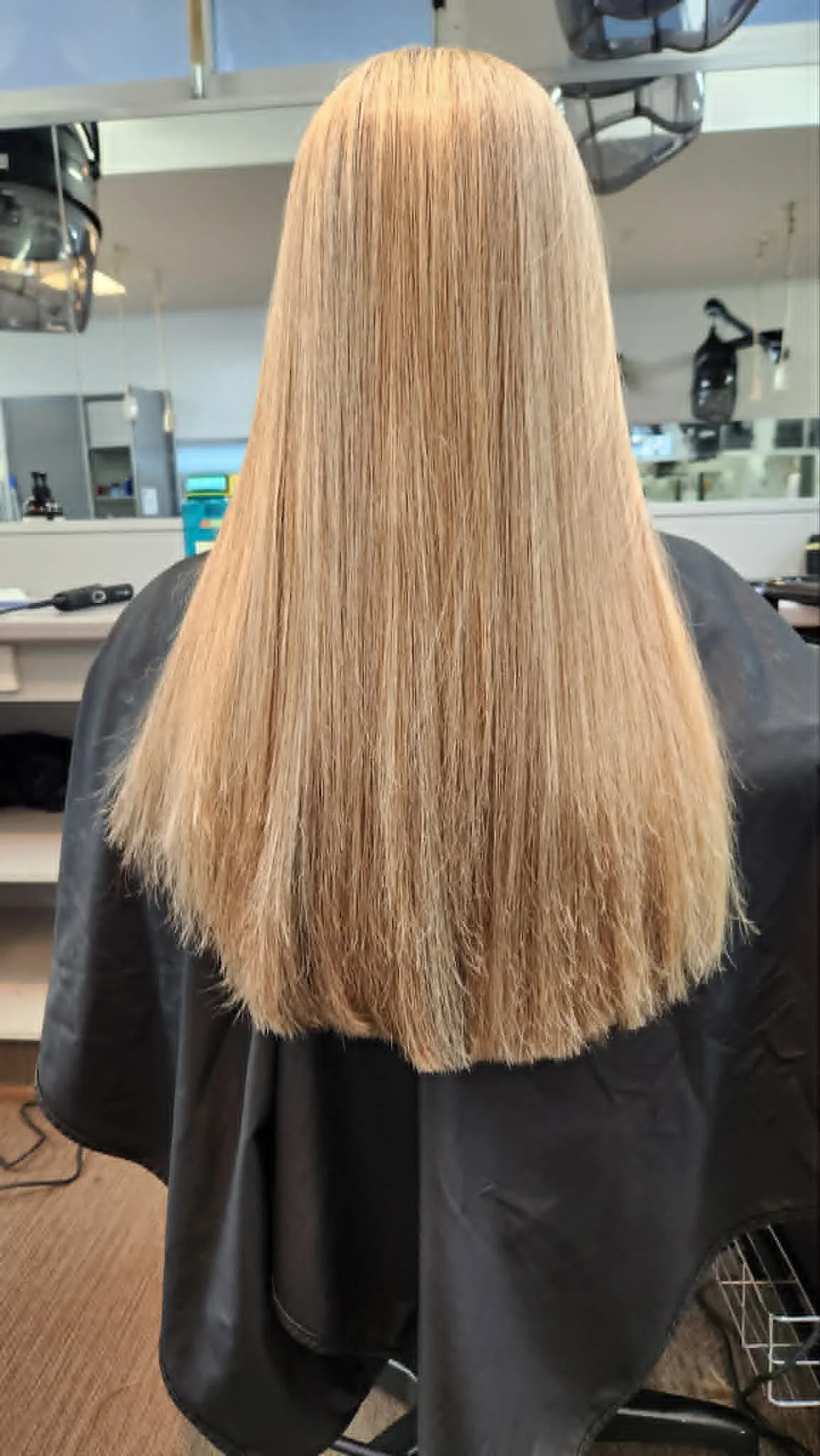 solid form hair cut woman sitting in hairdresser chair 