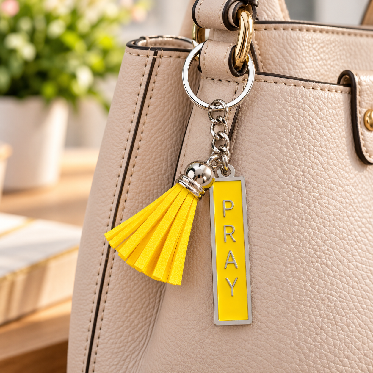 Cream Handbag with Yellow PRAY Charm.png