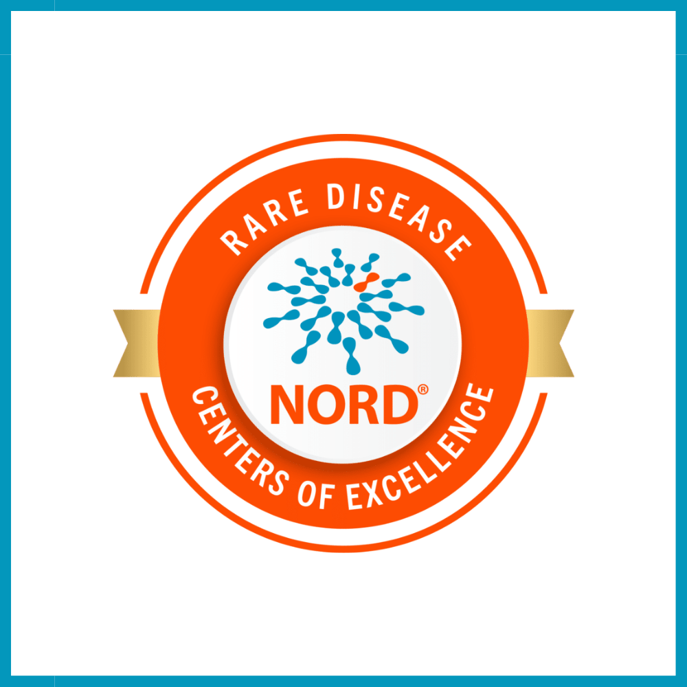 Badge with orange and gold emblem reading "Rare Disease Centers of Excellence" with blue molecular structure and the word "NORD" in the center.