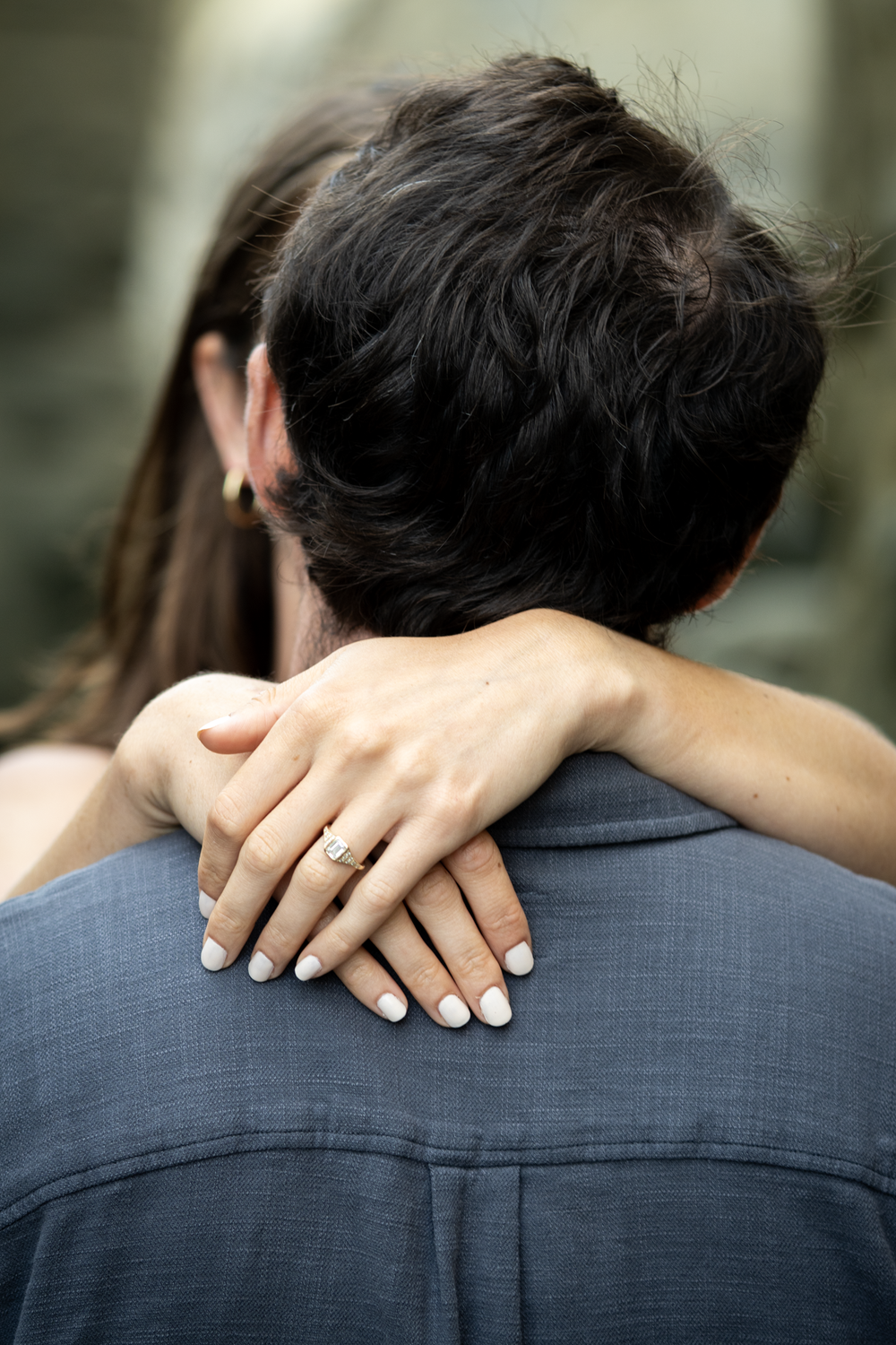 Close-up of Megan's hands wrapped around Mack's back