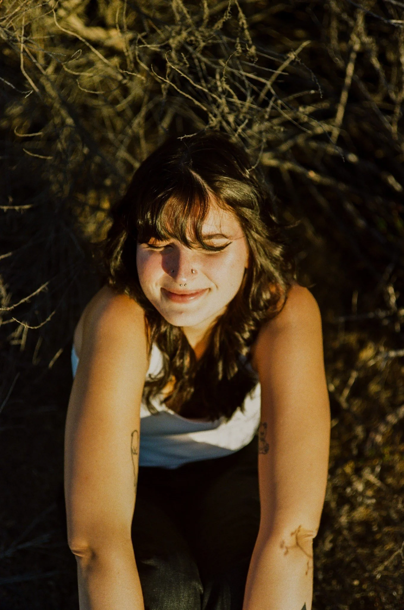 Laurel smiling in the dry grass, shot on film