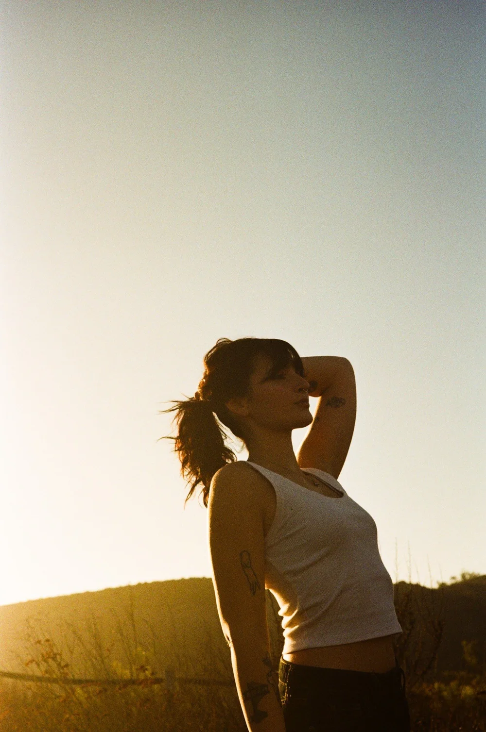 Laurel backlit at golden hour in El Cajon, shot on 35mm film