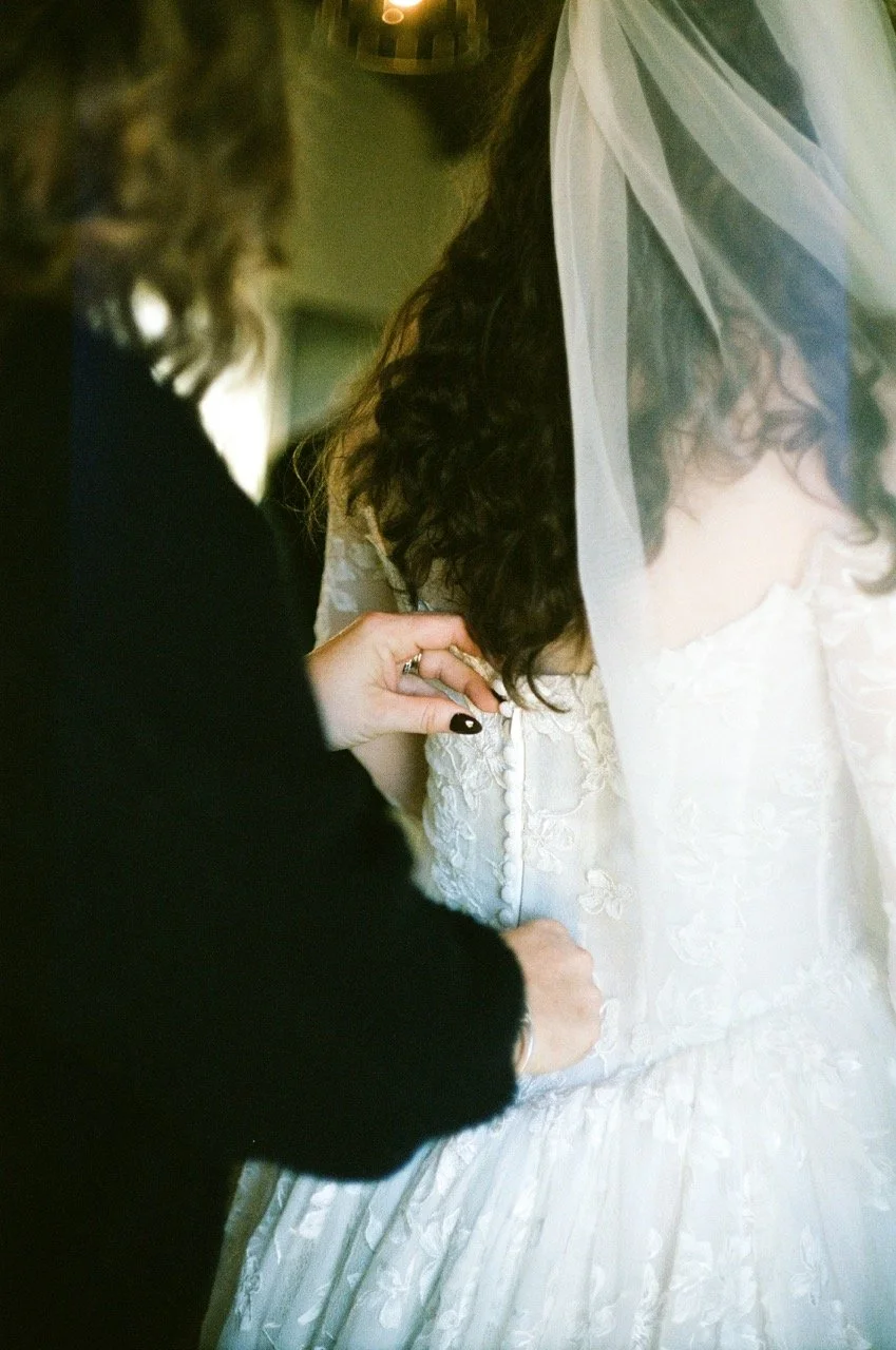 Carley and Preston close together under her veil, shot on film