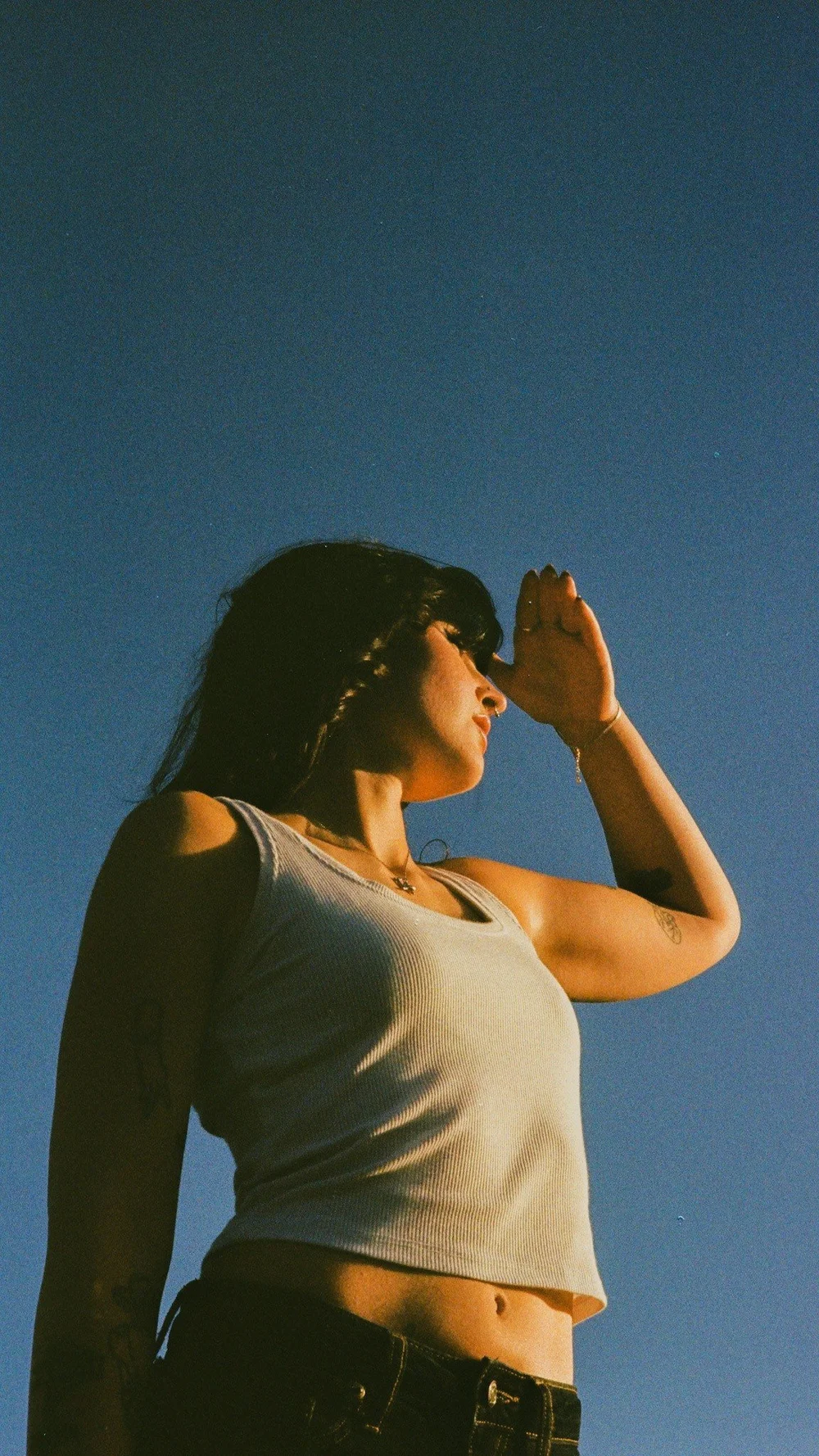 Laurel shading her eyes from the sun in El Cajon, shot on 35mm film