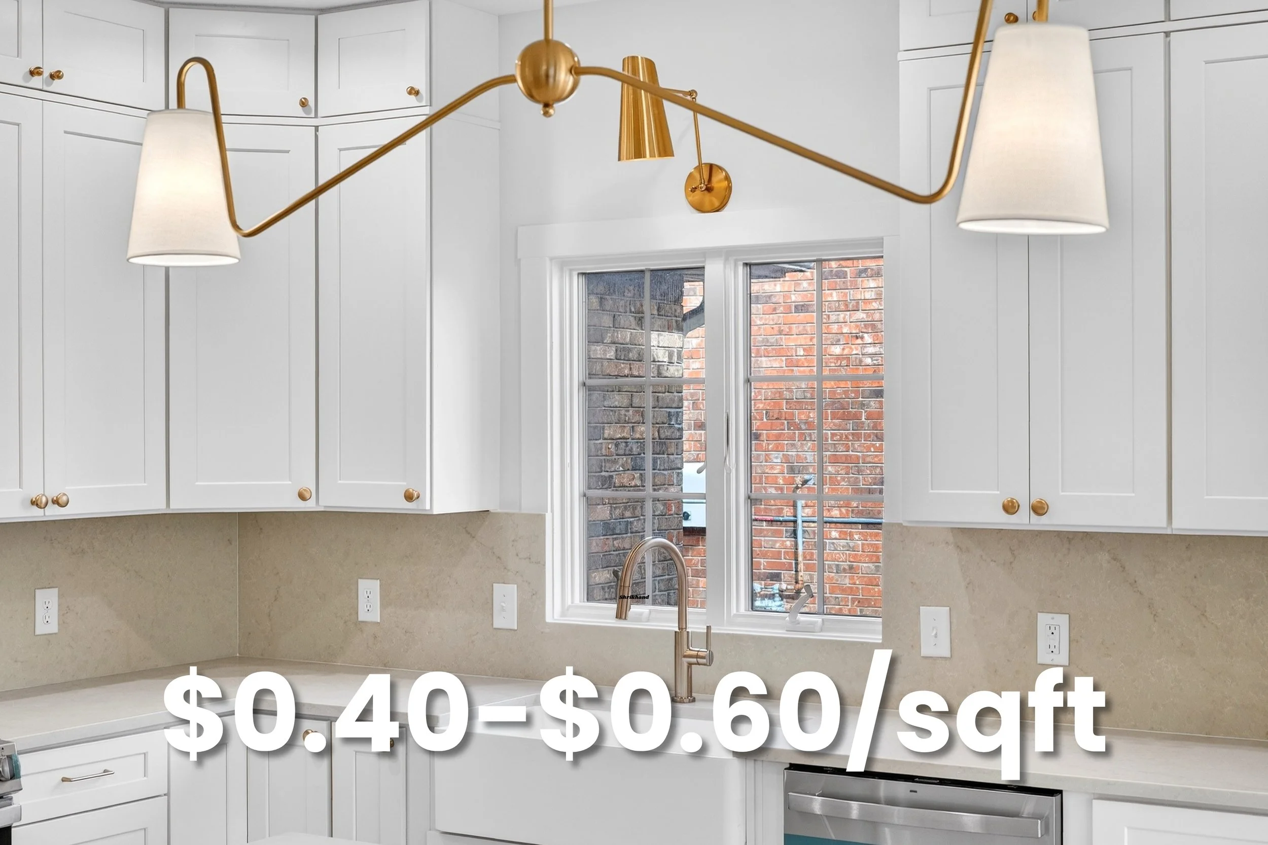 Kitchen with white cabinets, a window showing a brick wall outside, and a gold-colored light fixture with two shades. Text overlay indicates prices ranging from $0.40 to $0.60 per square foot.