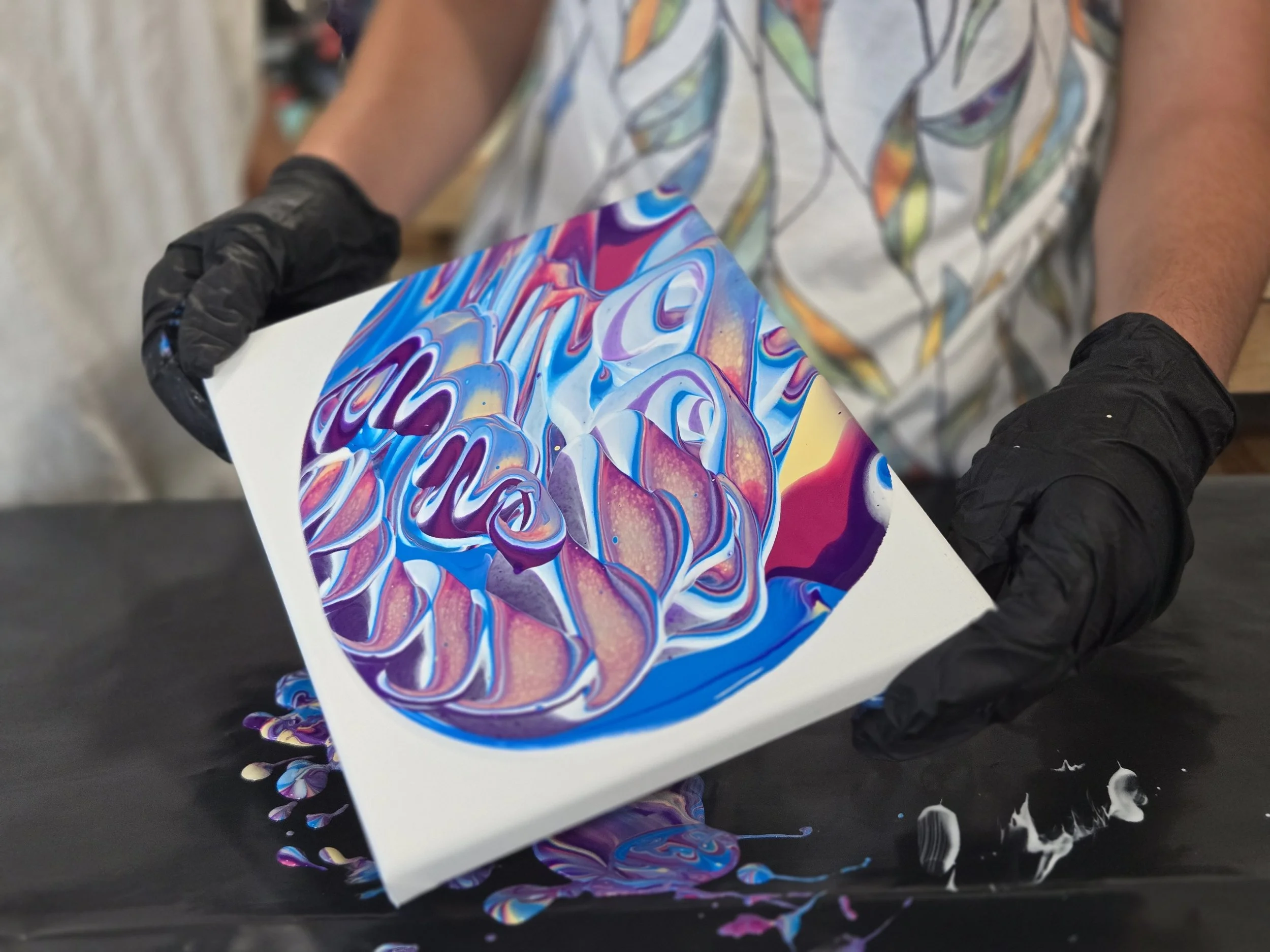 Stretching the paint, and opening the design is a key aspect of paint pouring...