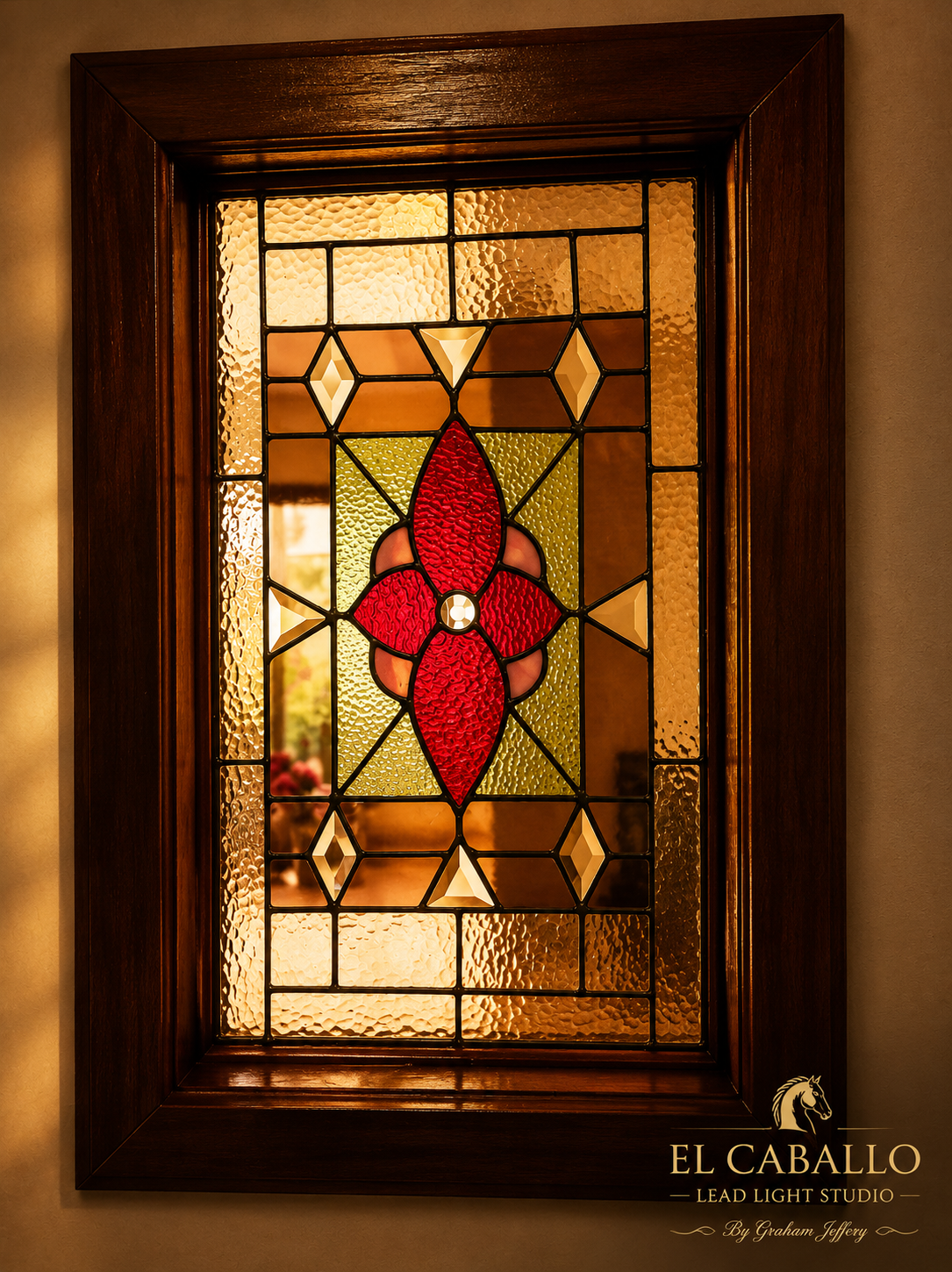 Decorative stained glass window with red floral design framed by dark wood, with textured amber, green, and clear glass elements.