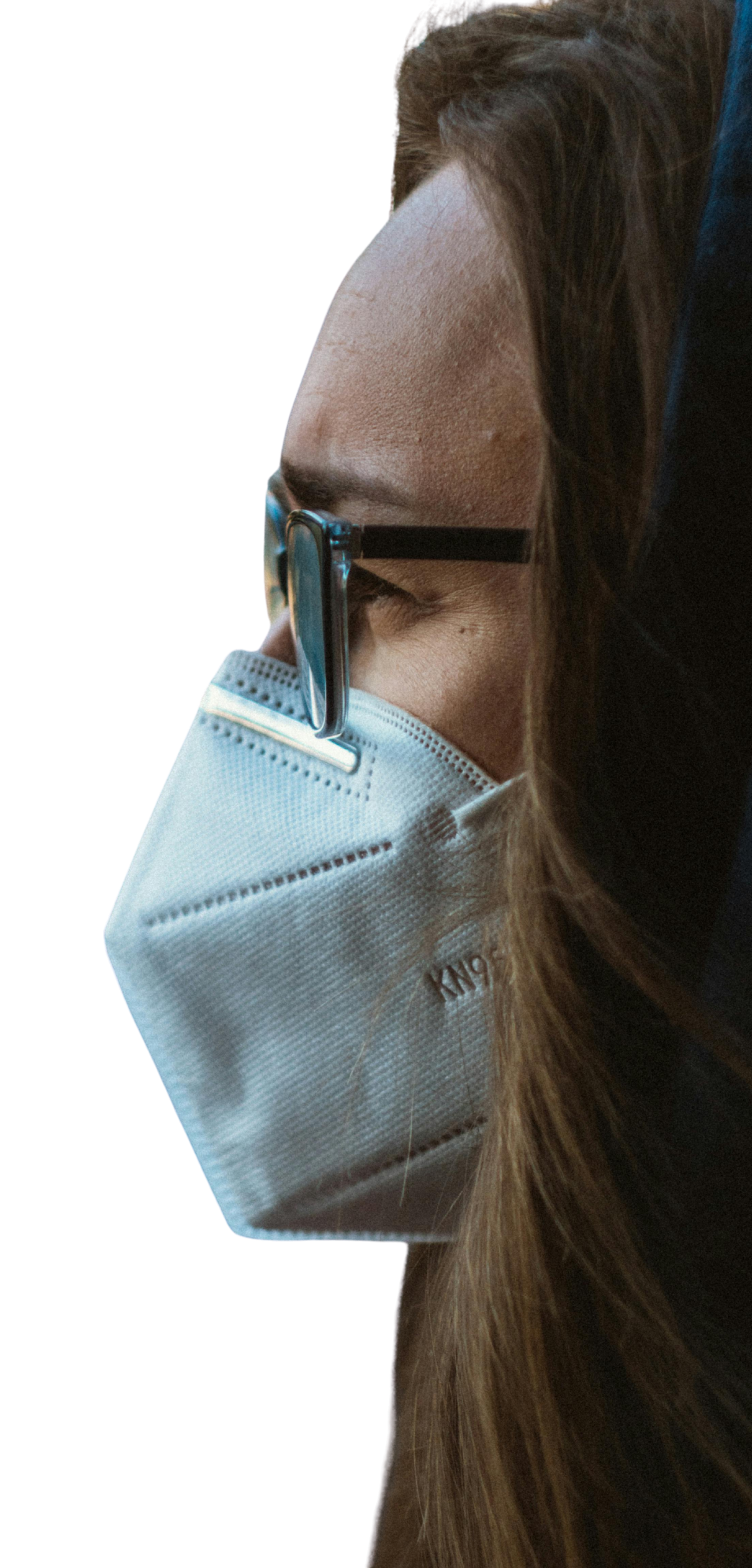A barely visible background image of the side profile a woman wearing a KN-95 mask.