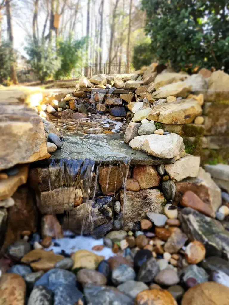 Custom outdoor water feature designed and installed by LawnSolver in Jacksonville, Florida.
