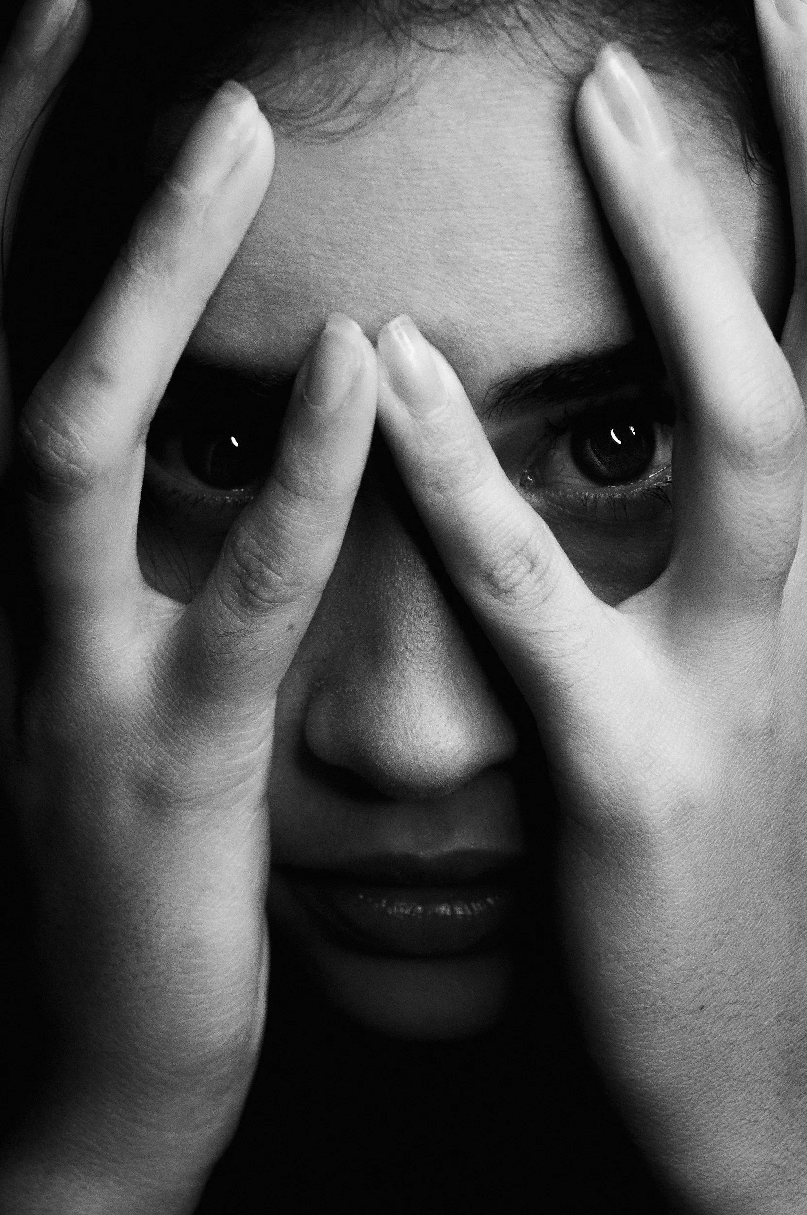 Woman experiencing fear and trauma symptoms during PTSD therapy