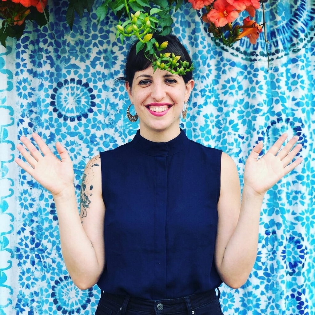 Fey Shreefter, LSW, trauma and EMDR therapist in Pennsylvania, smiling with blue background