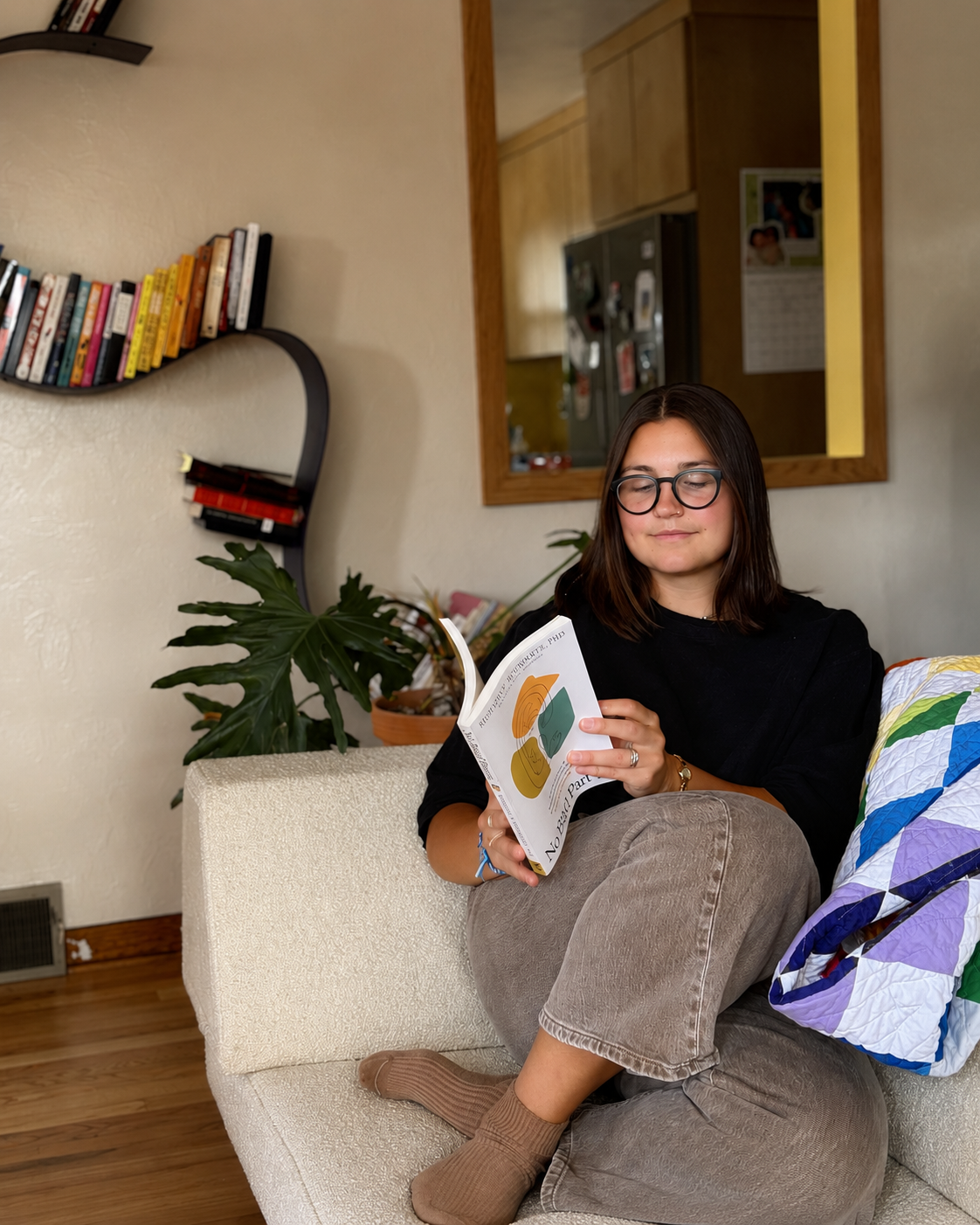 EMDR therapist reading on couch in PA
