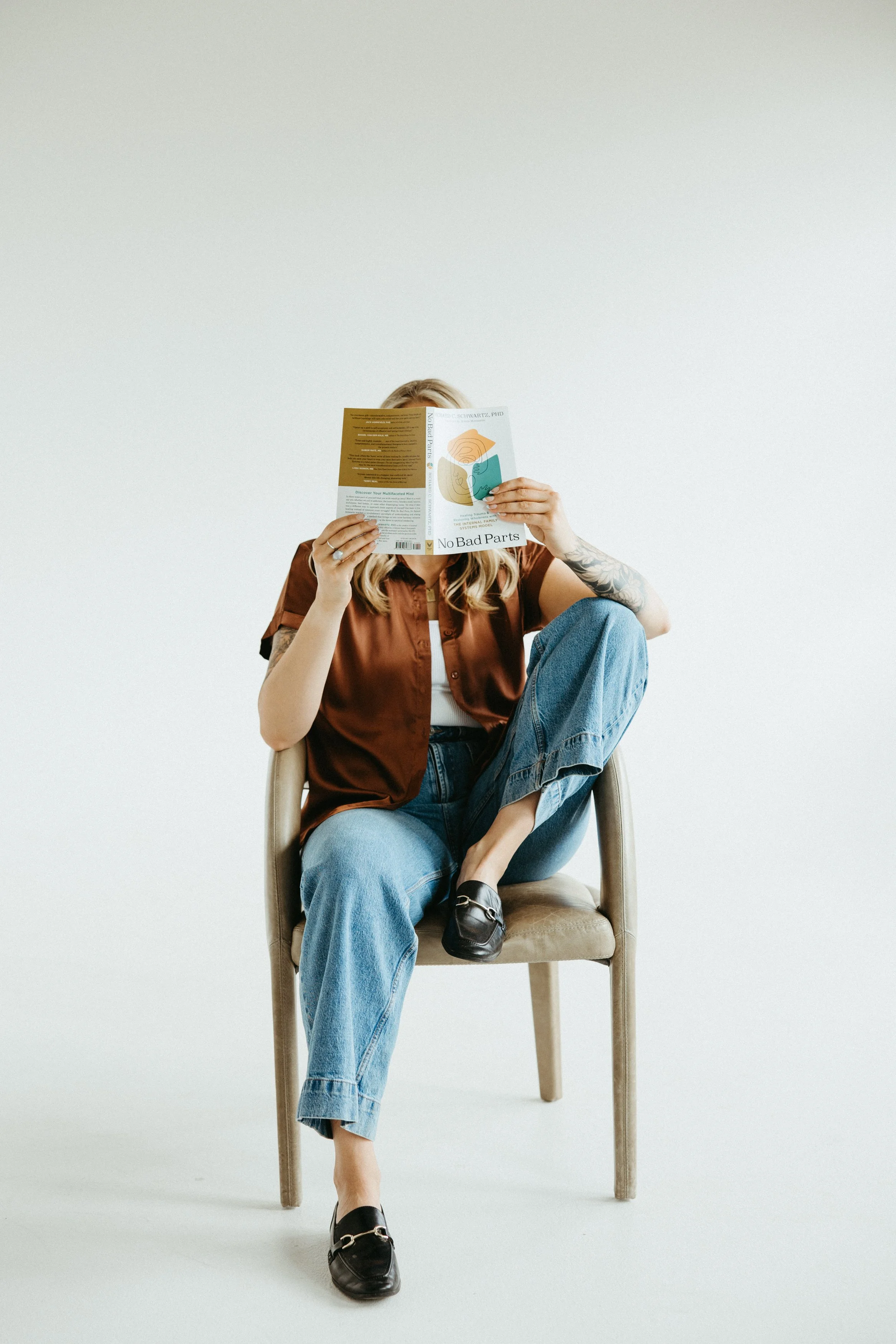 Therapist reading IFS book which helps binge eating recover in PA
