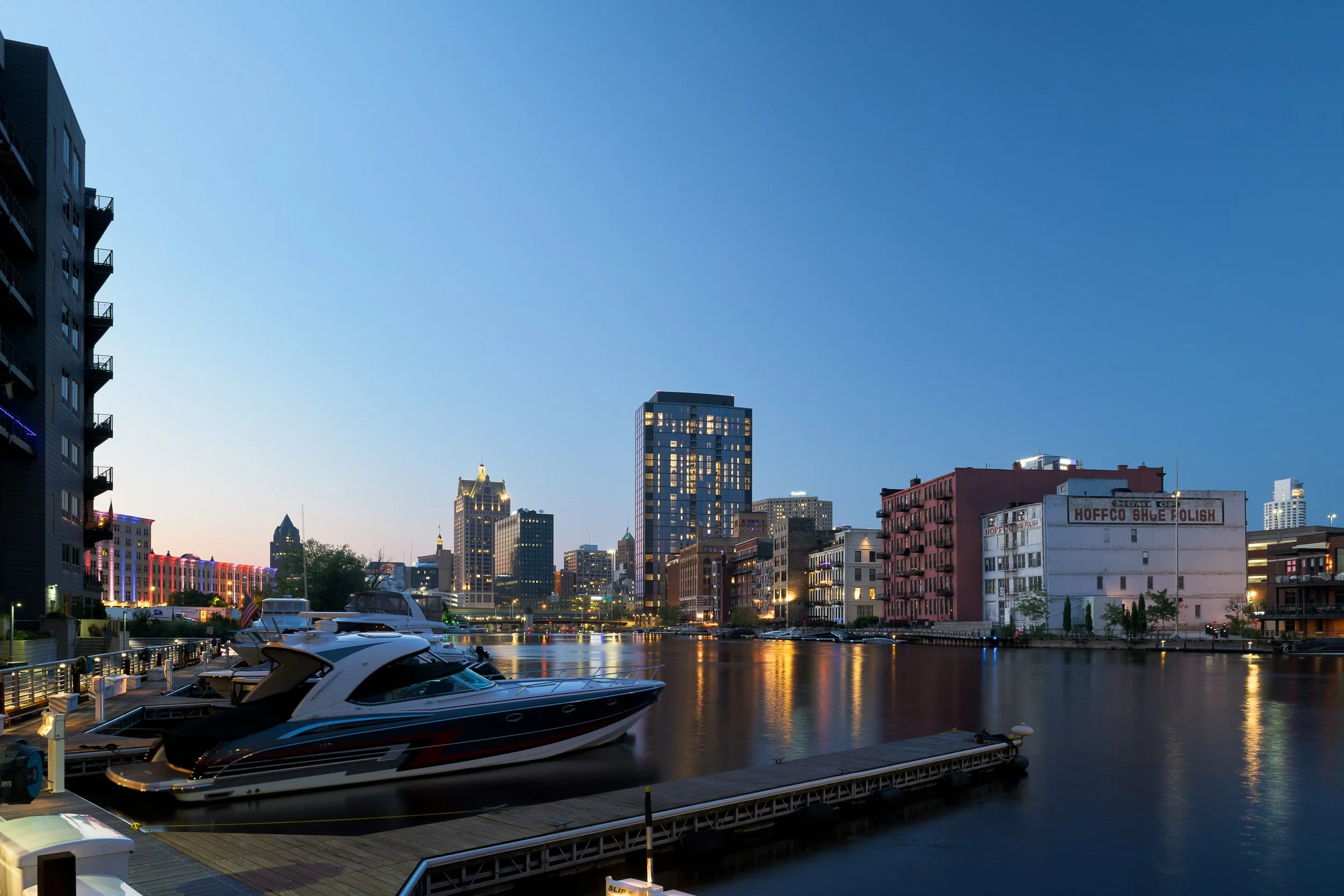 Urban waterfront cityscape at dusk with marina — commercial architecture photography Milwaukee
