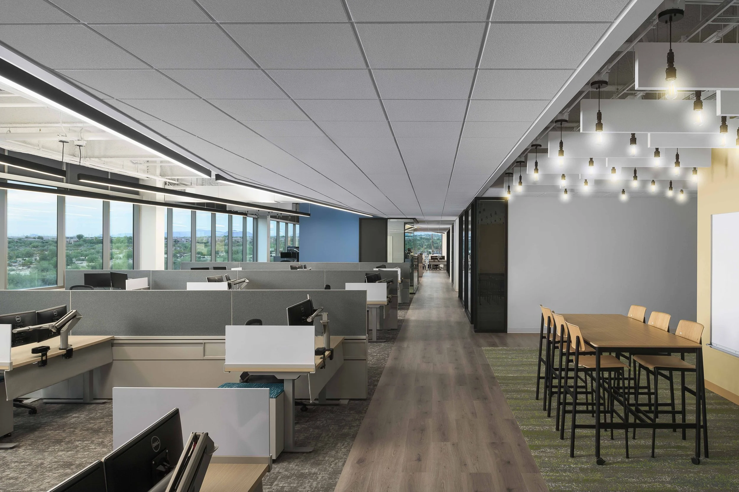 Long open-plan workspace with linear pendant lighting and clerestory windows — corporate office interior photography, Choice Hotels Technology HQ Scottsdale AZ